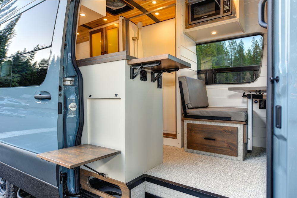 RV kitchen with the appliance bay open for service